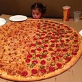 Little girl wishes she was everyone so she could eat the whole pizza