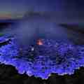 A volcano spewing blue lava