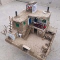 A small doll house mad out of mud