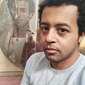 A modern Egyptian man taking a selfie with a 2000 years old portrait of an Egyptian man during the Roman era
