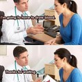 He's not looking at her boobs... he's a real doctor.