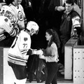 Figure skater Nancy Kerrigan receives a Boston Bruins jacket from player Ray Bourque at the Boston Garden on Feb. 3, 1994