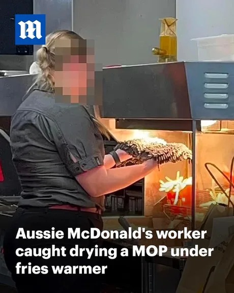 Aussie McDonalds woker drying a MOP under fires warmer - meme