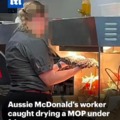 Aussie McDonalds woker drying a MOP under fires warmer