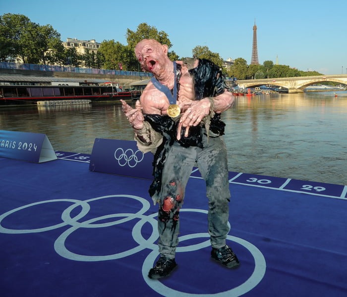 The winner of the Triathlon after swimming in the Seine. - meme