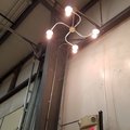 The electrical instructor made a "cool swirly light fixture" from conduit