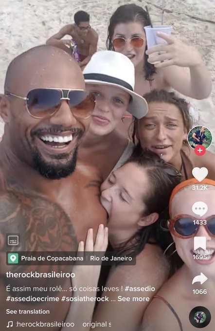 Your girl is biting on fake Dwayne's bicep - meme