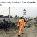 Medieval Knight visiting a poor village