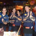 Workers singing happy birthday