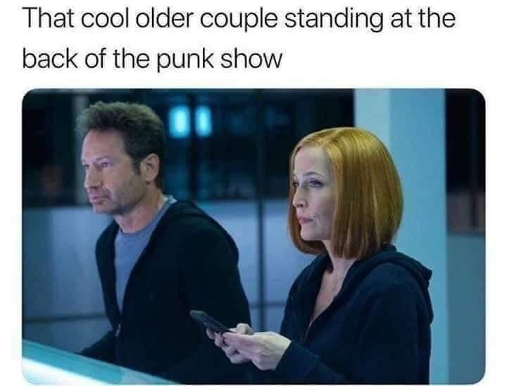 ﻿That cool older couple standing at the back of the punk show